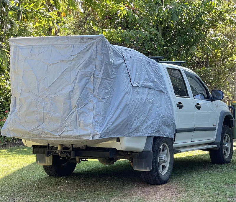 AdventureMax™ Ute Tent attached to dual cab ute during outdoor camping adventure.